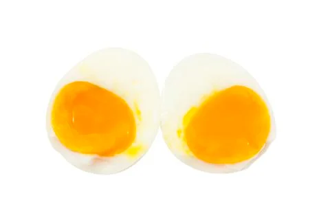 Boiled egg half slice with smooth egg york on top view Stock Photos
