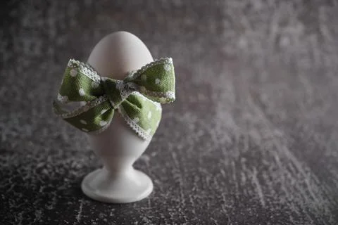 Boiled egg in holder on dark background Stock Photos