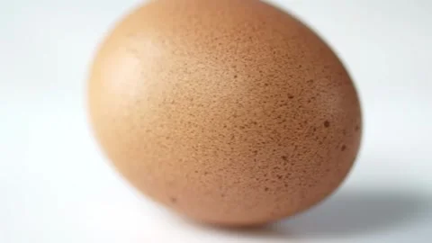 Boiled Egg Rotating on Surface Stock Footage 318410347