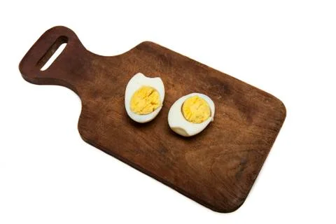 Boiled egg split in two halves Stock Photos