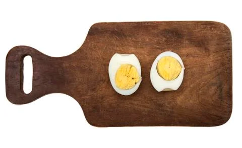 Boiled egg split in two halves Stock Photos