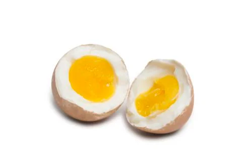 Boiled egg splitted in two half Stock Photos