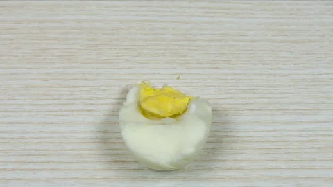 Boiled egg on a wooden background. Stop motion Stock Footage 74631243