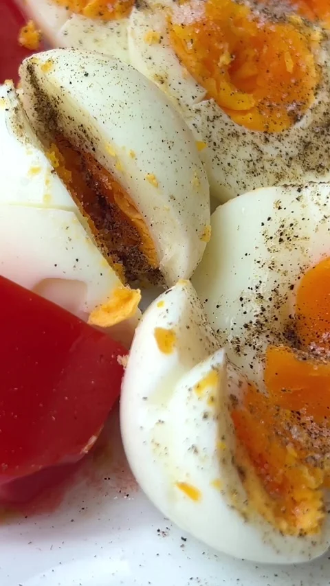 Boiled eggs with black pepper and tomatoes delicious pique macho is a Bolivian Stock Footage 309258735