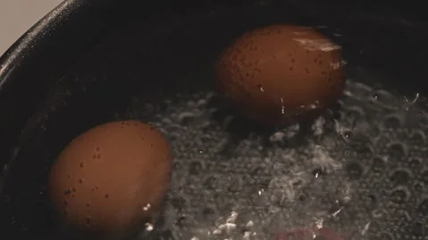 Boiled Eggs Cooking in a Pot Stock Footage 343733591