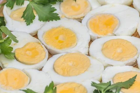 Boiled eggs cut in halves Stock Photos