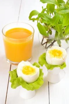 Boiled eggs in egg cups Foto stock