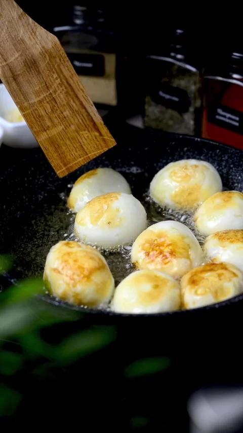 Boiled eggs in a frying pan. Eggs cooked in Chinese Stock Footage 247199037