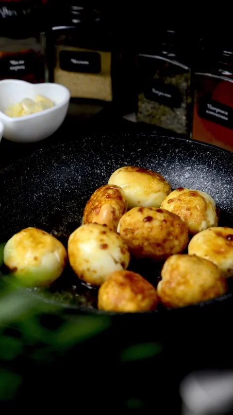 Boiled eggs in a frying pan. Eggs cooked in Chinese Stock Footage 247199145