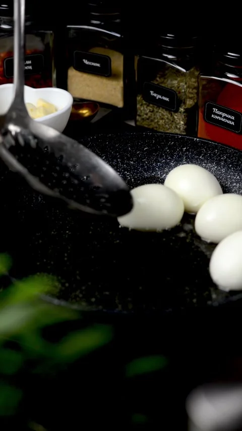 Boiled eggs in a frying pan. Eggs cooked in Chinese Stock Footage 247199154