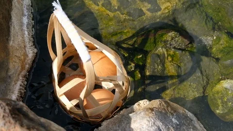 Boiled eggs with Round bamboo basket in hot spring and smoke at Chaeson Video stock 104086249