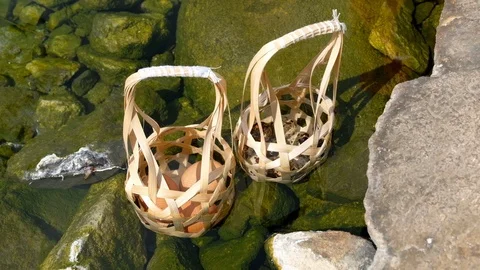 Boiled eggs with Round bamboo basket in hot spring and smoke at Chaeson Video stock 104088929