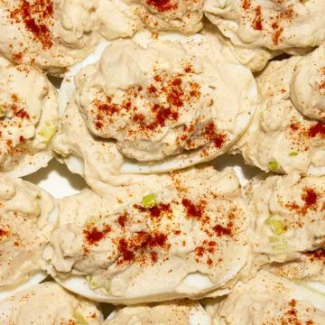 Boiled eggs stuffed with cod liver. Stock Photos