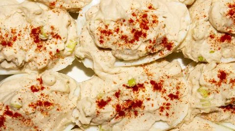 Boiled eggs stuffed with cod liver. Stock Photos
