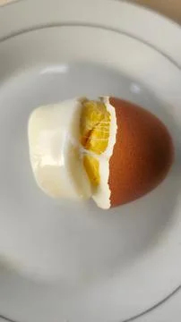 Boiled eggs with their shells peeled, ready for breakfast Stock Photos