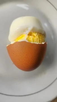Boiled eggs with their shells peeled, ready for breakfast Stock Photos