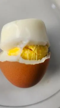 Boiled eggs with their shells peeled, ready for breakfast Stock Photos