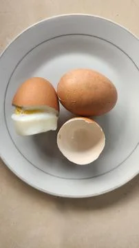 Boiled eggs with their shells peeled, ready for breakfast Stock Photos