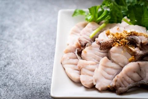 Boiled fish dip with sauce Foto stock