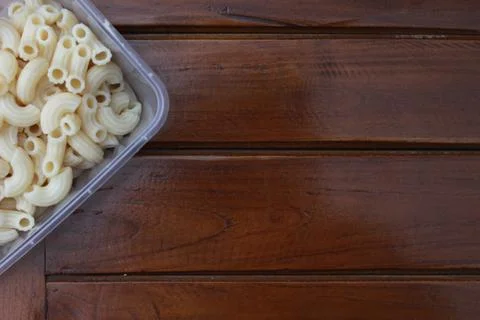Boiled macaroni in a transparent container Stock Photos