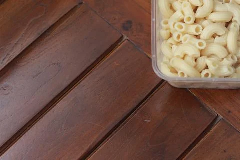 Boiled macaroni in a transparent container Stock Photos