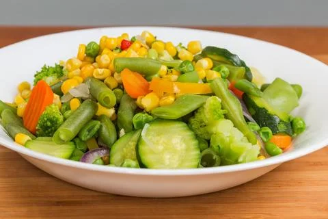 Boiled mixture of different vegetables close-up in selective focus Фото