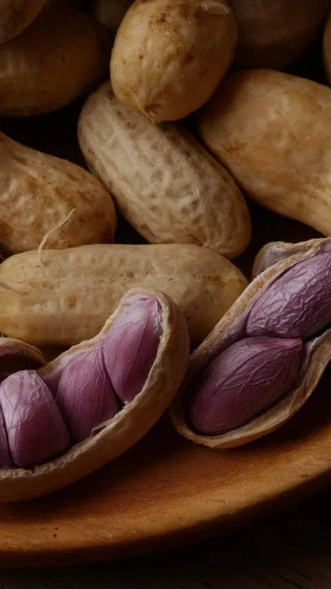 Boiled peanuts in shell with purple violet skin kernels revealed Video stock 331901032