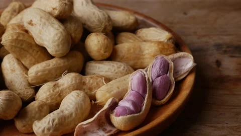 Boiled peanuts in shell with purple violet skin kernels revealed Stock Footage 332831368