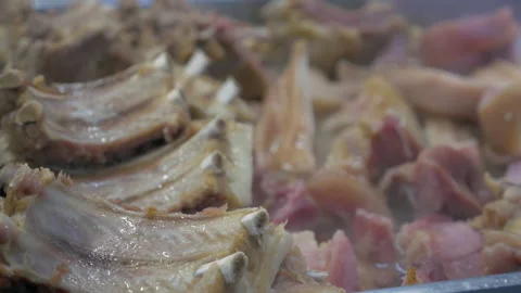 Boiled pork ribs and beef meat close up look, slow motion Stock Footage 149756385
