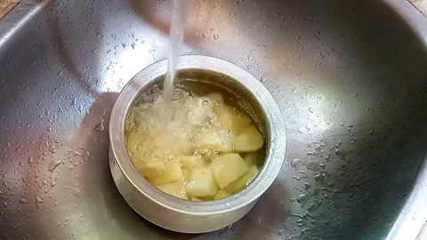Boiled Potato Chunks Cooling in Cold Water, Kitchen Stock Footage, Meal Video stock 329094813