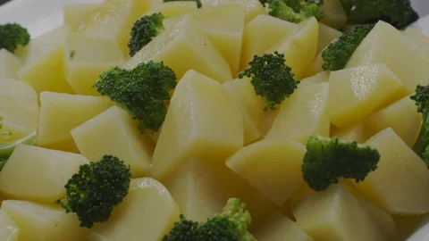 Boiled potatoes and broccoli Stock Footage 98298583