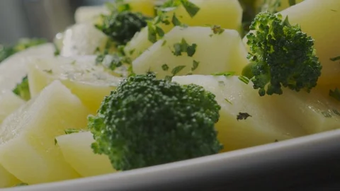 Boiled potatoes and broccoli Stock Footage 98299300