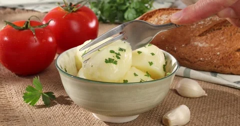 Boiled potatoes in a bowl. farm products on the table. simple country food. Stock Footage 241280098