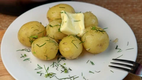 Boiled potatoes with butter Stock Footage 320248637