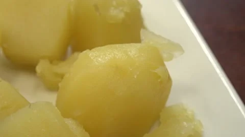 Boiled potatoes on a dish. Close-up Stock Footage 155685517