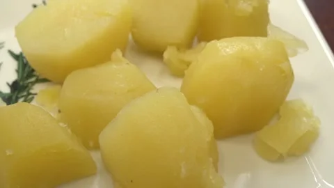 Boiled potatoes on a dish. Close-up Stock Footage 155685523