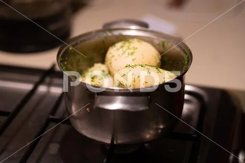 Boiled potatoes in a saucepan with dill Stock Photos