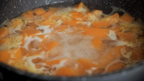 Boiled pumpkin for soup. Cooking vegetables. Healthy diet concept Stock Footage 101921865