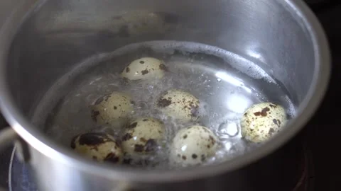 Boiled quail eggs, close-up, hot water Stock Footage 270482406