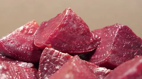 Boiled red beetroot cut into pieces, close-up shot Stock Footage 311453562