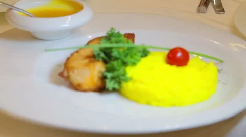 Boiled rice and fish fillets with sauce. Stock Footage 45754211