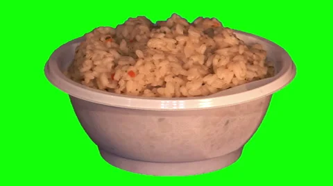 Boiled rice with vegetables in throwaway plate Stock Footage 47535735