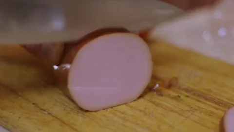 Boiled sausage slicing Stock Footage 83137368
