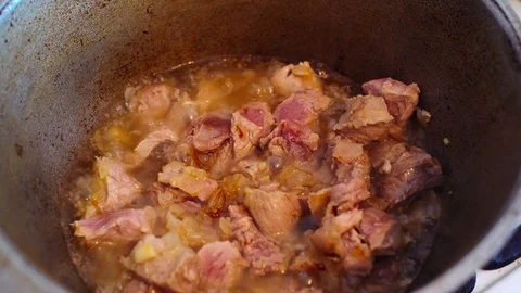 Boiled sliced meat in a pot of boiling water. Stock Footage 124842153