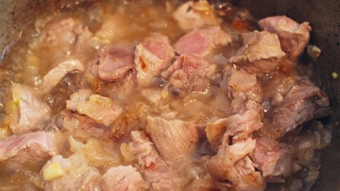 Boiled sliced meat in a pot of boiling water. Stock Footage 124843007