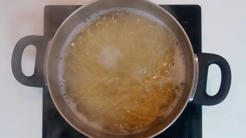 Boiled spaghetti pasta in a pan with hot water Stock Footage 150691502