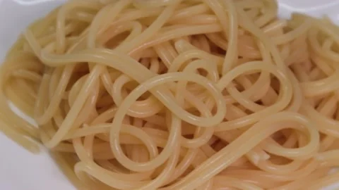 Boiled spaghetti on a plate Stock Footage 227527393
