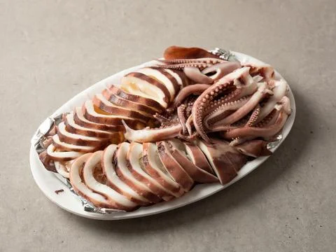 Boiled squid on a plate Stock Photos