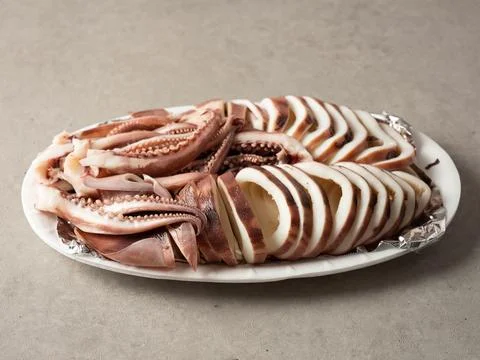Boiled squid on a plate Stock Photos