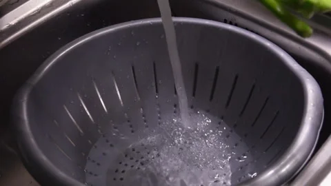Boiled stems of asparagus are put in cold water Stock Footage 118670632